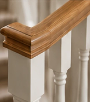 Illustrative oak handrail and white turned stair spindles